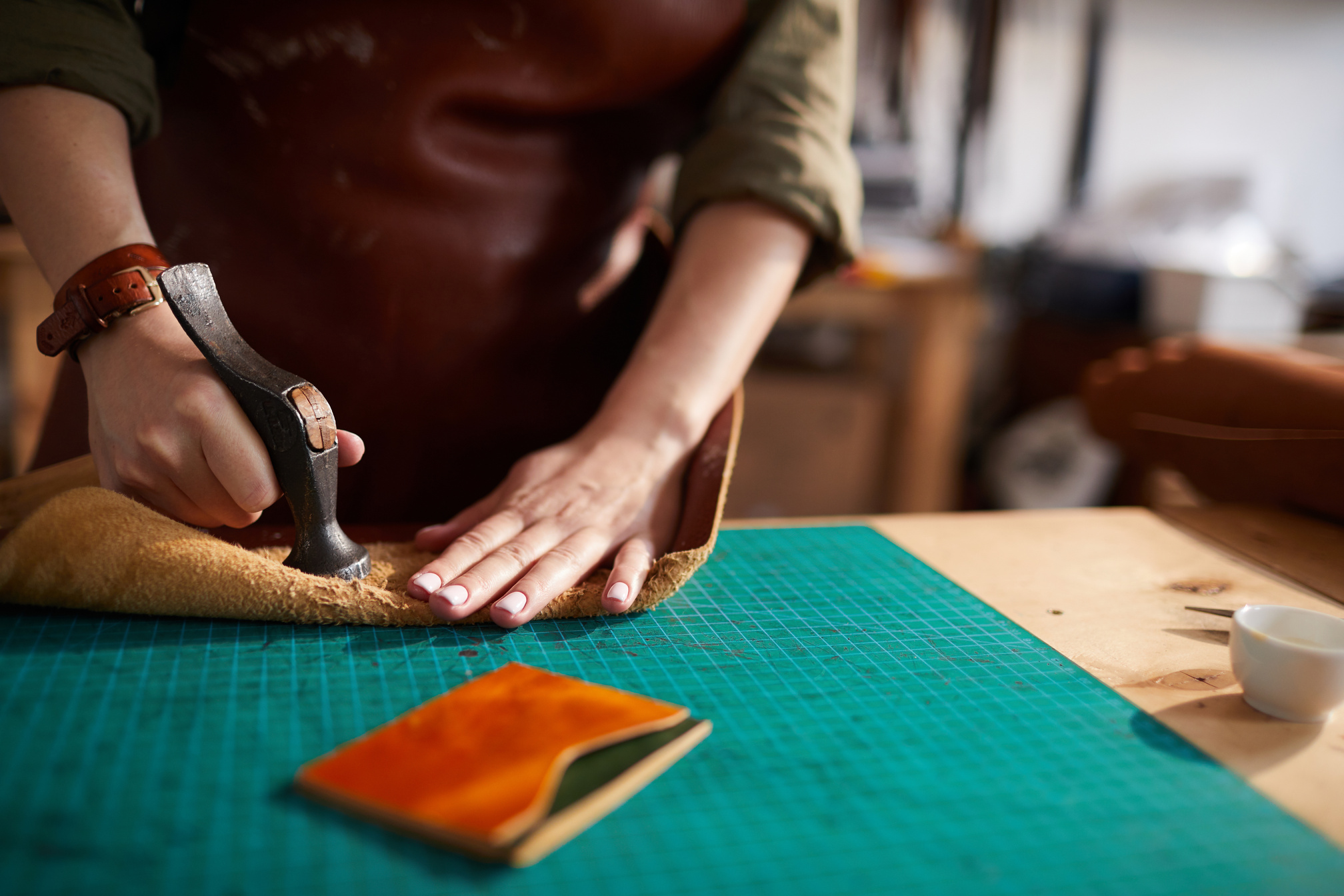 Woman Making Leather Wallet